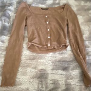 A long sleeve shirt in the color of beige
